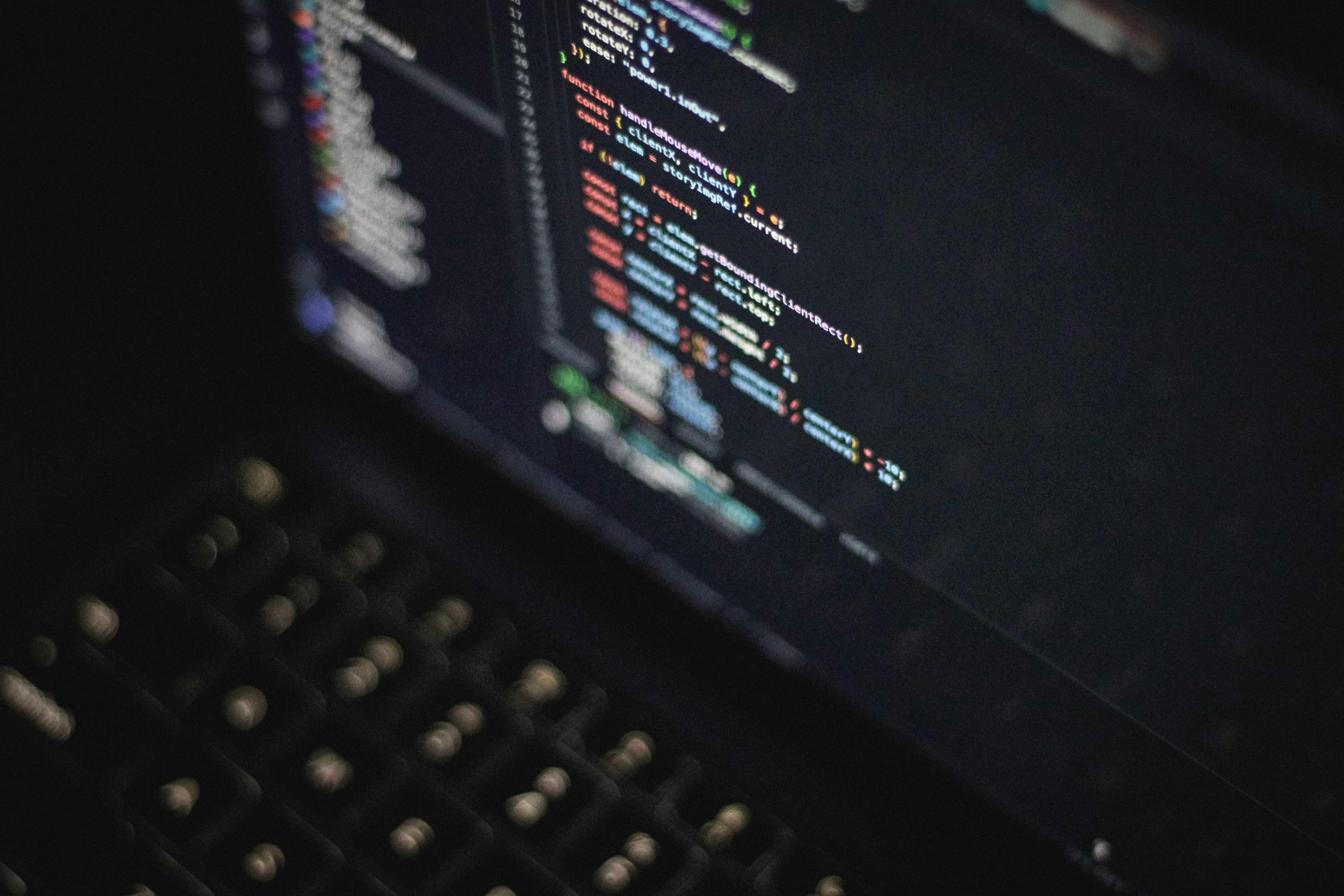 Code editor on screen in dark environment during late night coding session